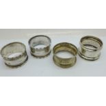 Two silver napkin rings, 31g, and a pair of plated napkin rings