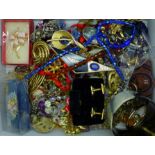 A collection of costume jewellery including brooches, cufflinks, etc.