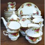 A Royal Albert Old Country Roses tea set and two cake plates, fourteen cups, nineteen saucers,