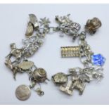 A silver and white metal charm bracelet