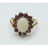 A yellow metal, opal and garnet ring, 2.5g, L