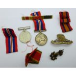 An Africa Service Medal, renamed, two badges, etc.