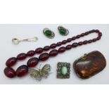 A purse, a/f, a sherry amber coloured bead necklace, jewellery and a silver salt spoon