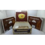 Two sealed boxes of Guantanamera Habana Cuba cigars and eight mixed size cigars in a Romeo y Julieta