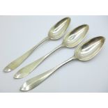 Three white metal spoons, with continental control marks, 165g, 21cm