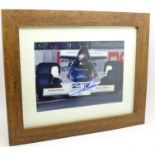 A framed and signed photograph of 1978 world champion Mario Andretti