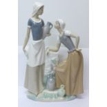 A large Nao by Lladro porcelain figure, Ladies at the Well Talking, model no. 02000178, designer