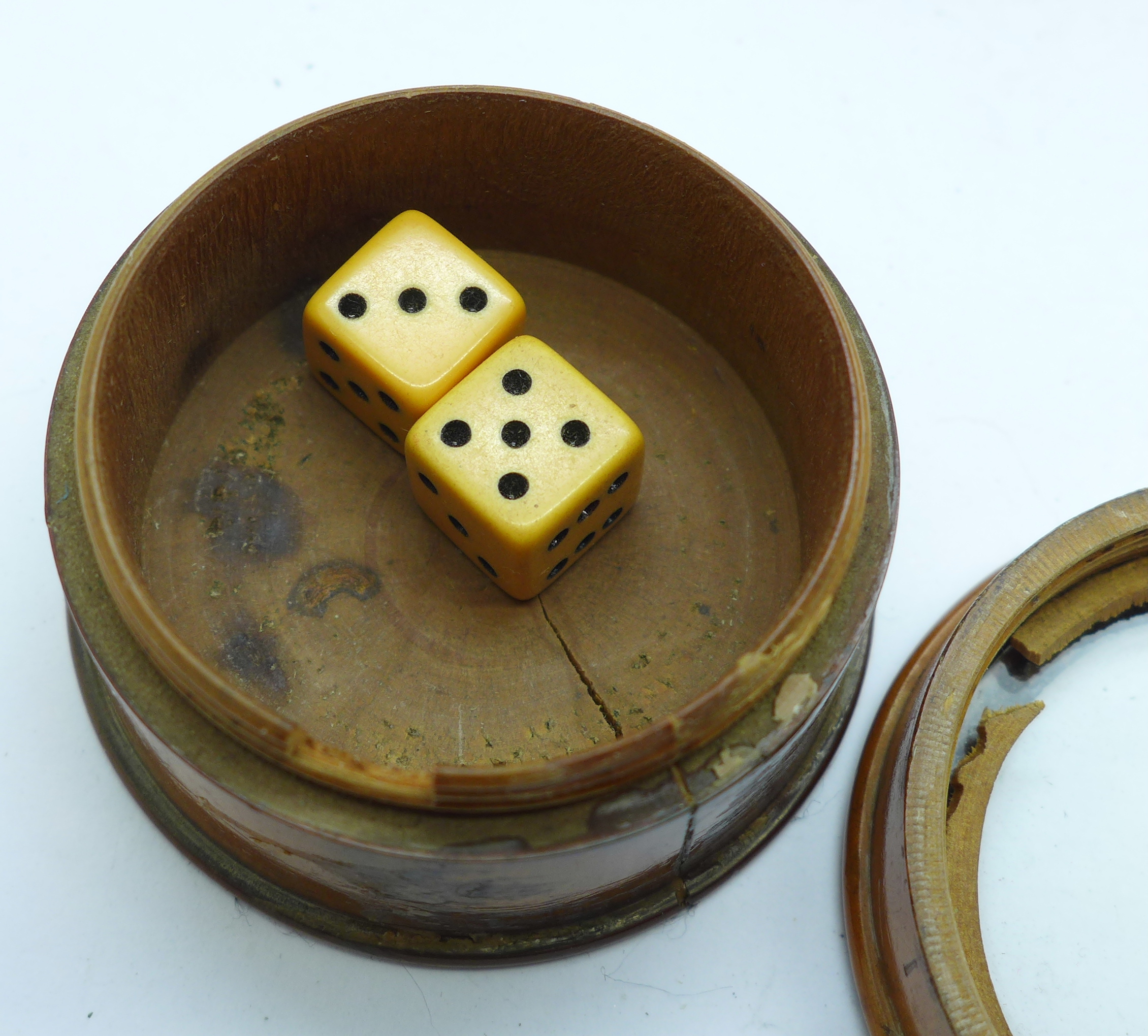 Three treen items including a dice shaker and a circular box depicting a religious scene in the - Image 2 of 4