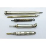 Five propelling pencils including two silver, one lacking clip, a/f