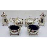 A six piece silver cruet set, Mappin & Webb, 307g, (some dents and scratches)