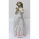 A large Nao by Lladro porcelain figure, Springtime, designer Jose Roig, 42cm, some restoration to