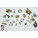 A collection of filigree jewellery, charms, a silver picture locket dated Birmingham 1899, etc.