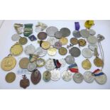 A collection of commemorative medallions, etc.