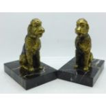 A pair of metal Art Deco dog bookends on marble bases, height 13.5cm