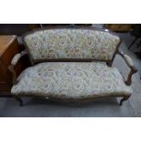 A 19th Century French walnut and upholstered salon settee