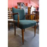 A teak and upholstered elbow chair