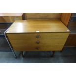 A teak chest of drawers