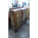 A carved oak display cabinet