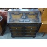 An oak geometric moulded bureau