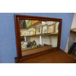 A Victorian walnut cushion framed mirror, 48 x 64cms