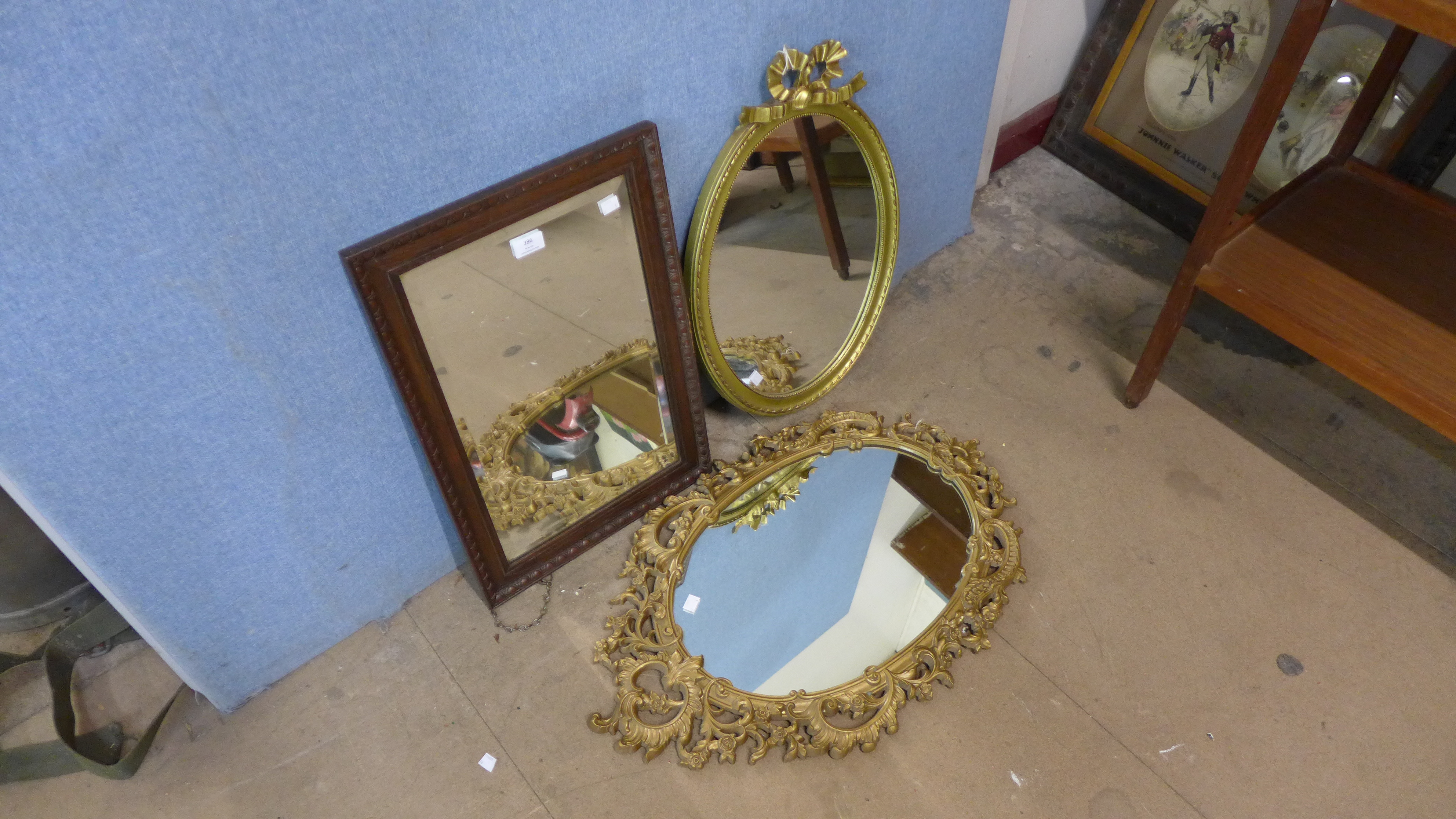 Two gilt framed mirrors and an oak mirror