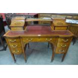 A Victorian Sheraton Revival satinwood and marquetry inlaid writing desk, 98cms h, 120cms w, 60cms d