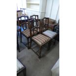 A set of four oak dining chairs