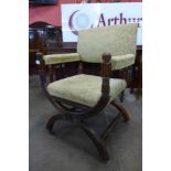 A Victorian Aesthetic Movement mahogany and upholstered x-frame armchair