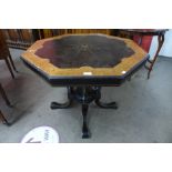 A Victorian Aesthetic Movement amboyna and ebonised octagonal centre table