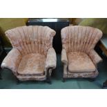 A pair of George I style walnut and upholstered shell back armchairs