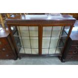 A mahogany two door bow front display cabinet