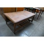 A teak and tiled top coffee table