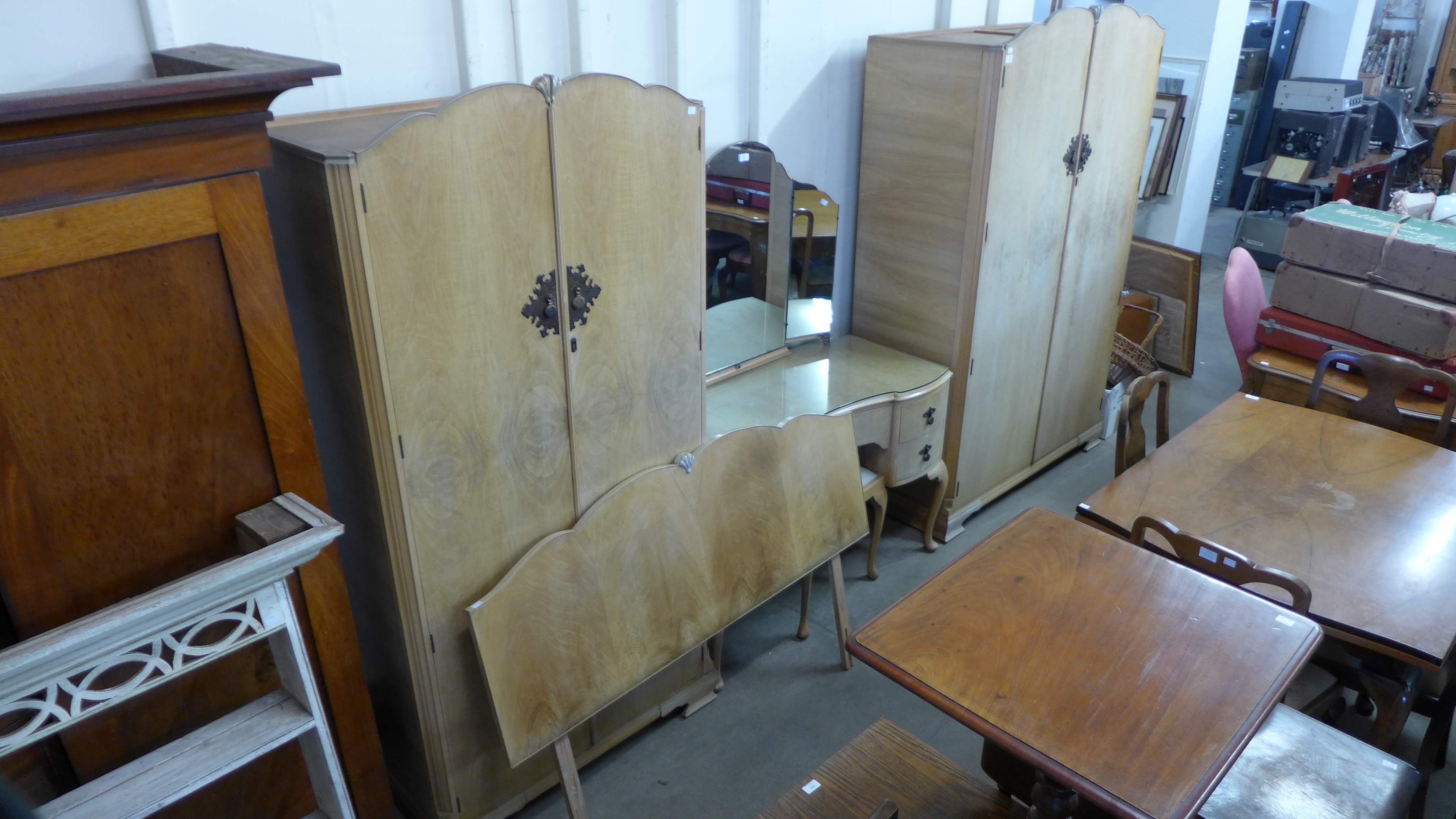 A bleached walnut five piece bedroom suite