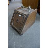 A Victorian oak and brass coal scuttle