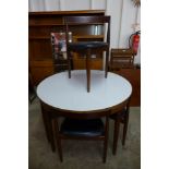 A Danish Frem Rojle teak and laminate top roundettee dining table and four chairs, designed by