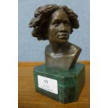 A French style bronze bust of a woman, on green marble socle, 14cms h