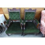 A pair of Edward VII walnut and upholstered armchairs