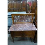 A Victorian oak and marble topped washstand