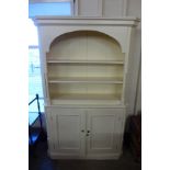 A white painted bookcase