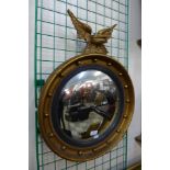 A Regency style gilt framed convex mirror, 66cms h