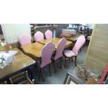 An Epstein style walnut dining table and six chairs, a/f