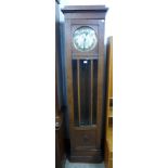 An oak longcase clock