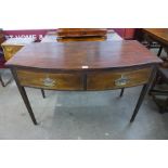 A George III mahogany bow front two drawer serving table