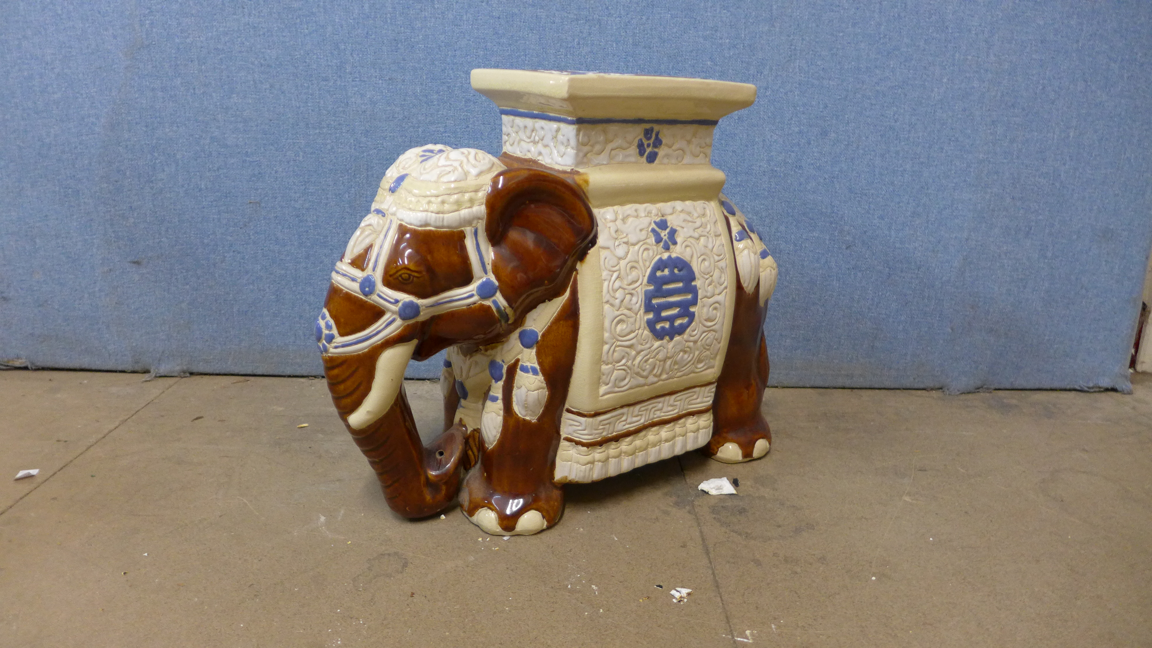 A ceramic elephant garden stool