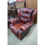 A red leather Chesterfield armchair