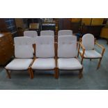 A Suite of seven Ercol beech and upholstered chairs