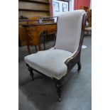 A Victorian mahogany and upholstered lady's chair