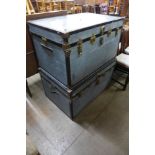 Two metal steamer trunks