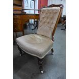 A Victorian walnut and upholstered lady's chair