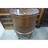 A mahogany demi-lune side cabinet